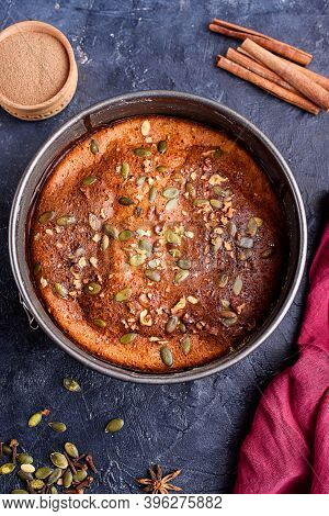 Pumpkin Pie With Lemon Zest, Pumpkin Seeds, Cinnamon, Fragrant And On A Dark Background. Healthyfood