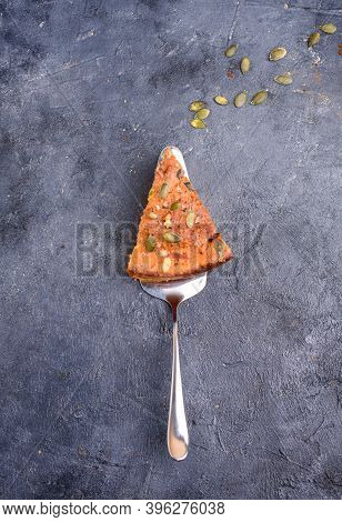 Pumpkin Pie With Lemon Zest, Pumpkin Seeds, Cinnamon, Fragrant And On A Dark Background. Healthyfood