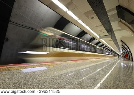 Motin Blured Metro Moving In A Station