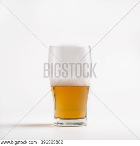 Most Delicious Craft Beer For Client In Pub During Oktoberfest. Half Glass Goblet Of Light Drink Wit