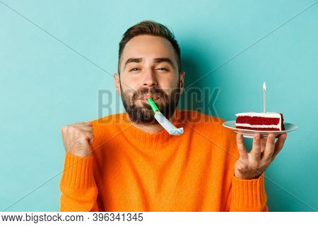 Close-up Of Funny Adult Man Celebrating His Birthday, Holding Bday Cake With Candle, Blowing Party W
