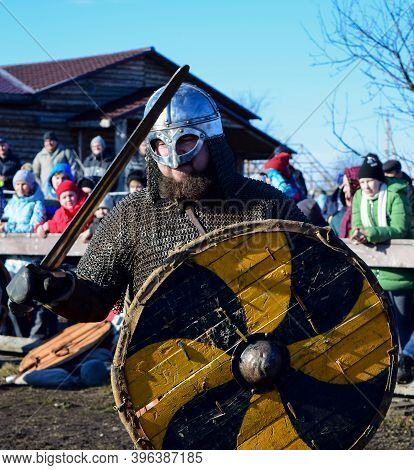 An Artist Dressed As A Viking With A Weapon. Village Argamac Palna. Lipetsk Region. Russia. March 20