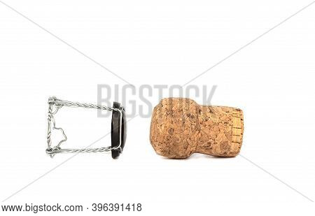 Champagne Cork And Muselet Separately On A White Background. Copy Space. Close Up.