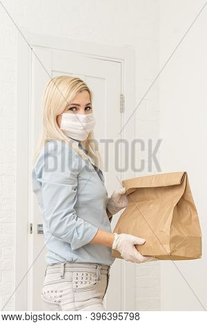 Transportation, Post And People Concept - Smiling Young Woman Opening Cardboard Box At Home