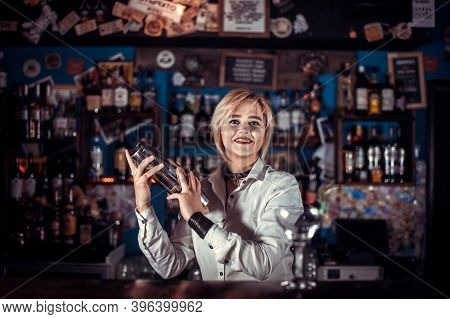 Girl Bartender Makes A Cocktail On The Porterhouse