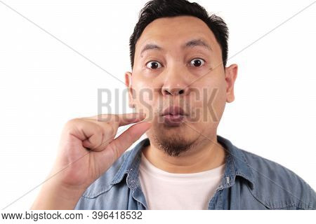 Keep Secret, Man Zipping Locking Mouth Shut Gesture, Mute And Silence Concept