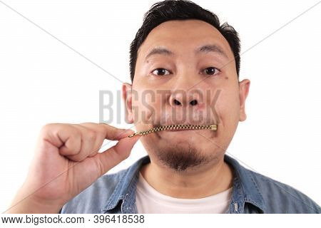 Keep Secret, Man Zipping Locking Mouth Shut Gesture, Mute And Silence Concept