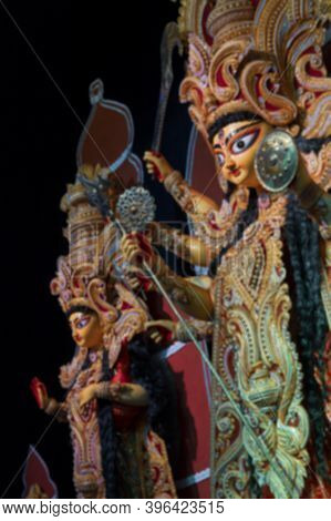Blurred Image Of Durga And Laxmi Idol At Decorated Durga Puja Pandal, Durga Puja Festival At Night. 
