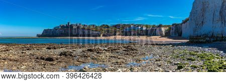 MARGATE, Kent, UK: 21 May 2020: Visitors to Margate's Main Sands beach surrounded by white cliffs during the heatwave in Britain.