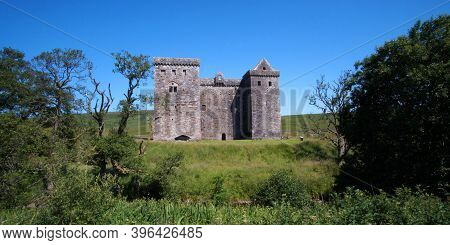 Hermitage Castle Is A Half-ruined Castle On Hermitage Water, Located In The Scottish Borders Area Of