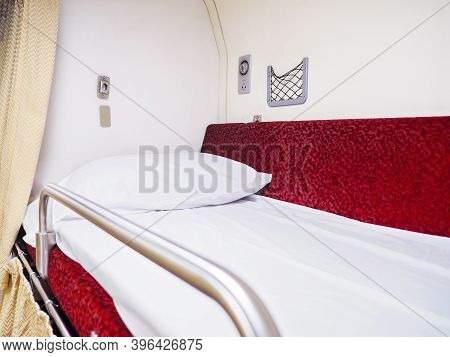 White Pillow On Upper Storey Bed In Thai Second Class Sleeper Cabin New Express Train.