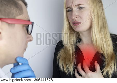 A Woman Grabs His Chest In The Region Of The Heart. Heart Attack Or Chest Pain. The Concept Of Heart