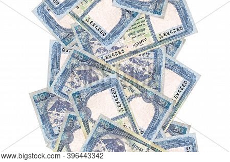 50 Nepalese Rupees Bills Flying Down Isolated On White. Many Banknotes Falling With White Copyspace 