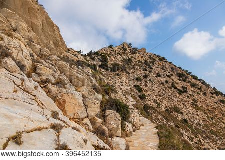 Stone Mountain Path To Palaiokastro, Ruins Byzantine Castle On The Top Of Hill. Ios Island, Greece.