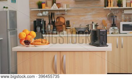 Bread Toaster In Kitchen With Nobody In It. Modern Dining Room With Coffee Machine In Cozy Interior 