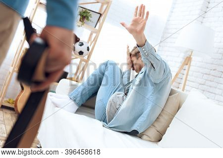 Father Approaches His Son With Belt Ho Hit Him. Troubled Teenager Isn't Defending Himself.
