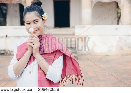 Portrait Of Asian Woman Wearing Laos Traditional Clothing And Holding Plumeria Flower (dok Champa) I