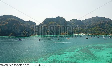 Turquoise Clear Water. Yachts, Boats Floating. Water Gradient From Light To Dark Blue. Phi Phi Don I