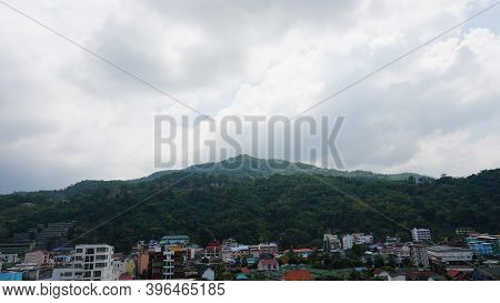 Drone View Of The City Of Patong, Phuket Island. Houses Of Different Heights Stand On The Beach. Gre