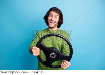 Photo Of Young Driver Person Impressed Open Mouth Toothy Smile Green Sweater Isolated On Blue Color 