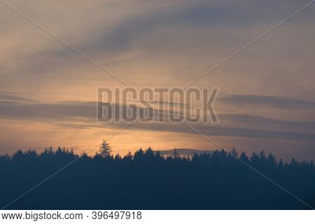 Sky Cloudscape At Dusk, Just After Sunset, With Plenty Of Copy Space For Text. Line Of Silhouetted C