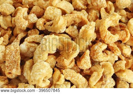 Close Up Of Pork Snack Or Pork Scratching At Market, Crispy Fried Pork Skin And Blistered Is Traditi