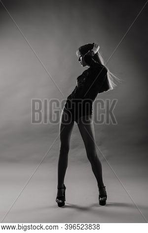 Young Beautiful Dancer Posing In Studio On Grey Background