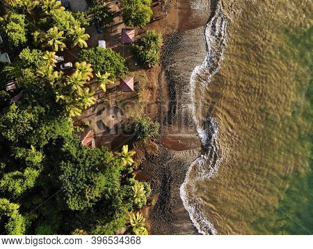 Guadeloupe Beach Drone Sunset View. Plage Caraibe Black Beach Aerial View In Pointe Noire. Backlit O