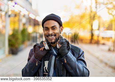 Portrait of a handsome young man on the city street 