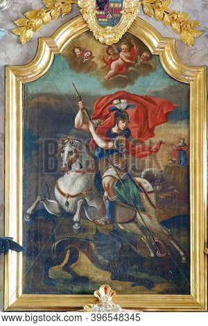 PLESIVICA, CROATIA - JULY 22, 2013: Saint George altarpiece on the high altar in the parish church of Saint George in Plesivica, Croatia