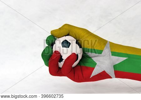 Mini Ball Of Football In Myanmar Flag Painted Hand On White Background. Concept Of Sport Or The Game
