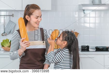 Mother And Children Is Playing With Homemade Bread In The Kitchen For Family Activity Togetherness C