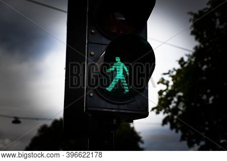 Green Man Walking Traffic Light At A City Crosswalk.
