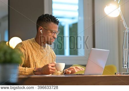 Portrait of african american trendy guy in a distant online call