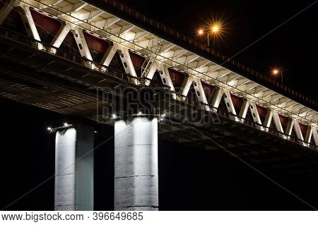 Bridge At Night Lights. Rapid Transit And Car Bridge For Traffic Flow. Beautiful Industrial Structur