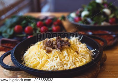 Banosh, A Traditional Ukrainian Corn Grain Dish With Fat And Sheep Cheese. Style Rustic. Selective F