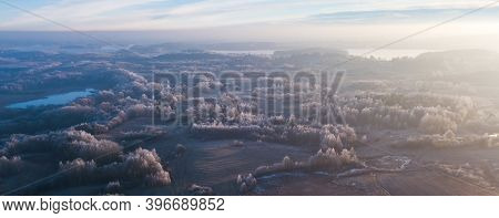 Aerial View From Above Of A Countryside Landscape With Beautiful Sunset Light On A Winter Evening Wi