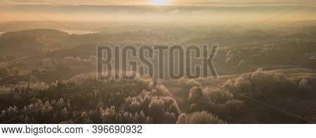 Aerial View From Above Of A Countryside Landscape With Beautiful Sunset Light On A Winter Evening Wi