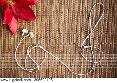 Neutral Brown Background With Empty Copy Space For A Musical Event. The Concept Of Music In The Reco