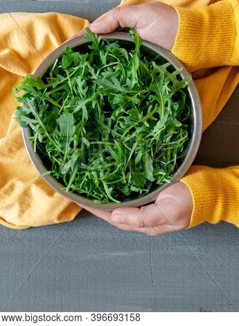 Plate Arugula Green Hand Yellow Gray Background Copy Space Fortuna Gold Colour