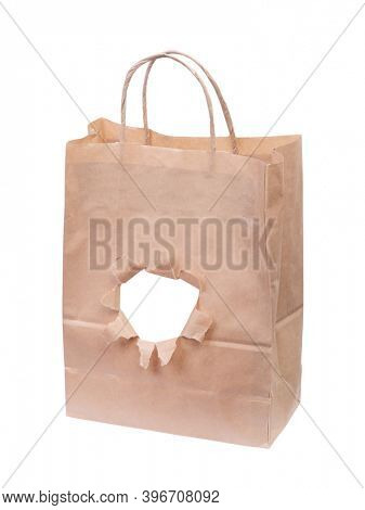 Paper bag with a torn hole isolated on white background