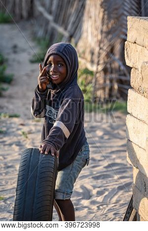Ghana Boy Posing With His Car Tire In A Small Village In Ghana Called Keta 2020 November 11
