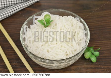 Konjac Or Shirataki Noodles With Chinese Chopsticks. Japanese Traditional Dish. Healthy Food For Wei