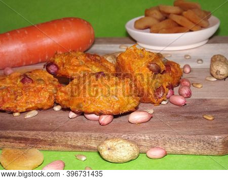 The Process Of Making Carrot Cookies With The Addition Of Dried Apricots, Peanuts And Sunflower Seed