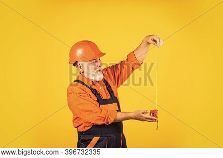 Ready To Work. Engineer Size Measuring. Construction Man Hold Measuring Tape. Engineering And Repair