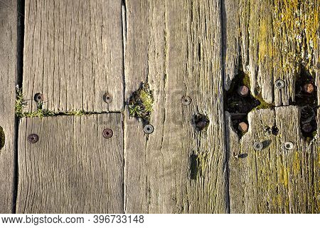 Close-up Of Brown Weathered Boardwalk Planks Background.