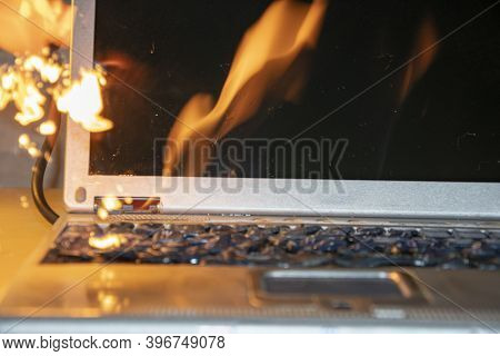 In The Room On The Table The Laptop Caught Fire, The Ignition Of The Battery And Contacts, A Short C