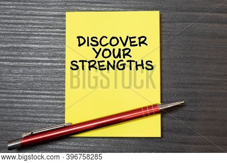 Discover Your Strengths Written On Note. Business Concept. Top View