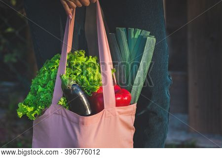Close Up Of Pink Reusable Eco Bag With Fresh Bio Vegetables. Plant Based Vegan Diet. Healthy Food Cl