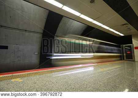 Motin Blured Metro Moving In A Station